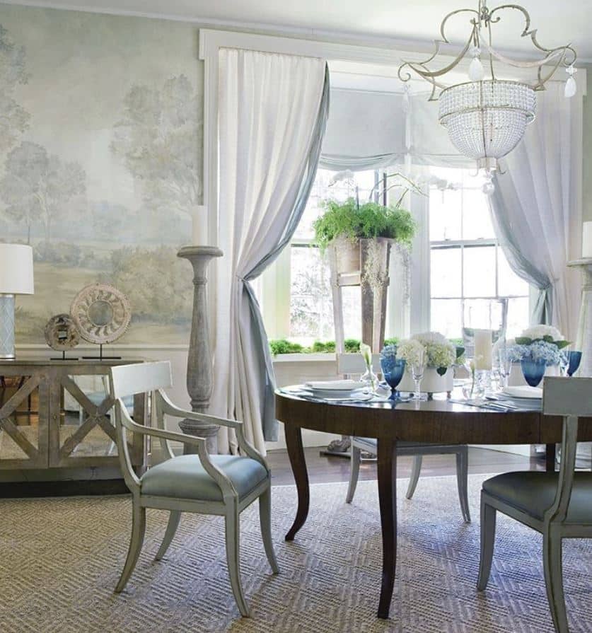Bright dining room with scenic mural wallpaper