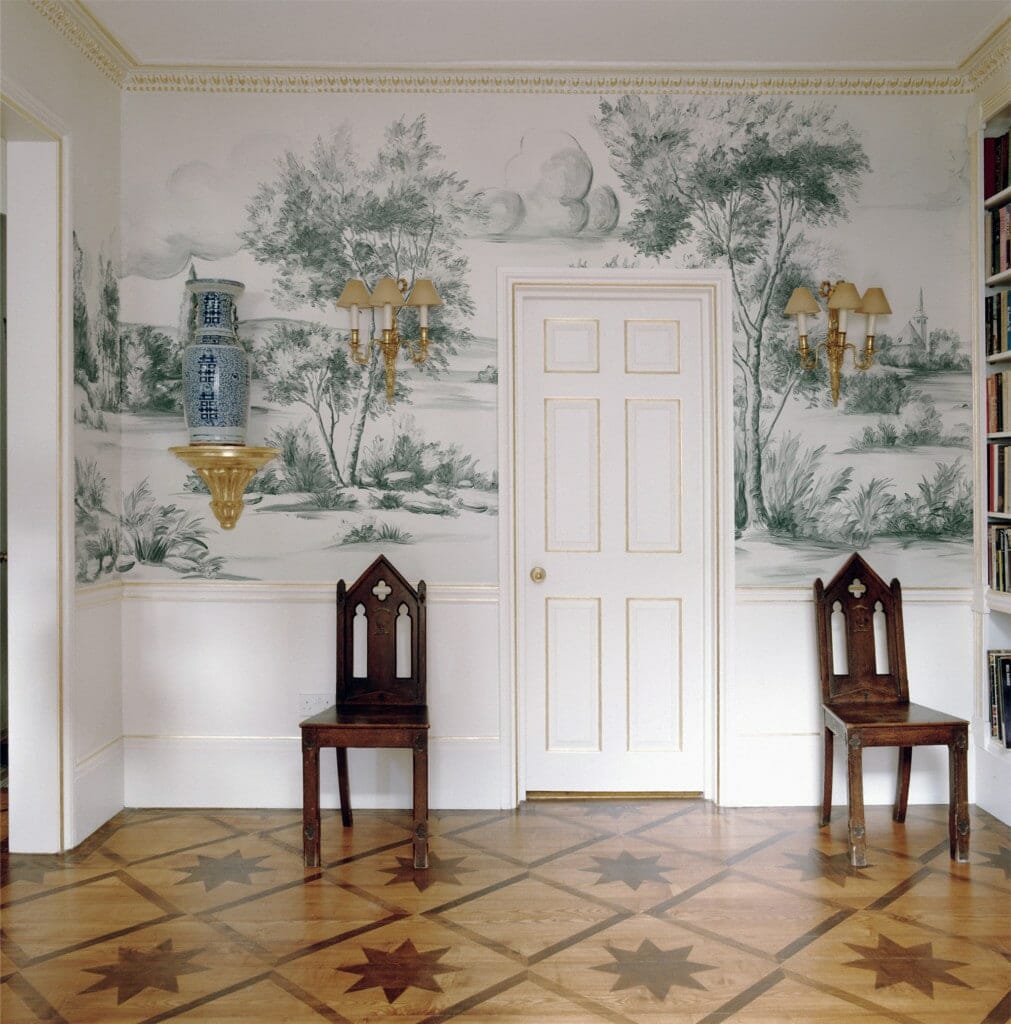 Room with antique chairs and scenic mural wallpaper