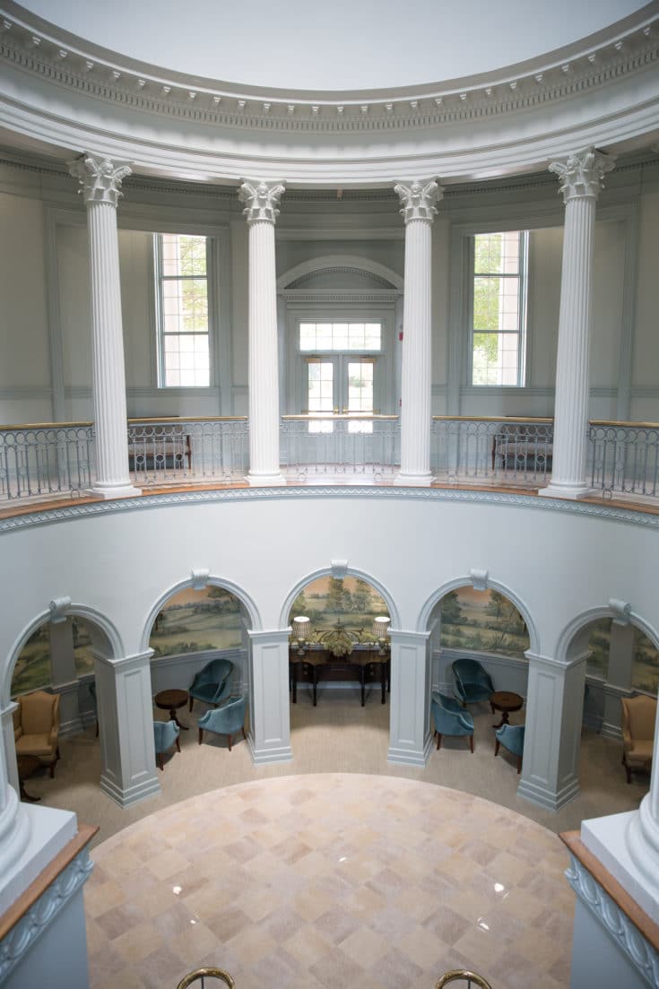 Multi-level rotunda with sitting areas and mural wallpaper