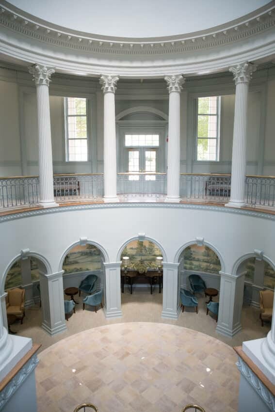 Multi-level rotunda with sitting areas and mural wallpaper