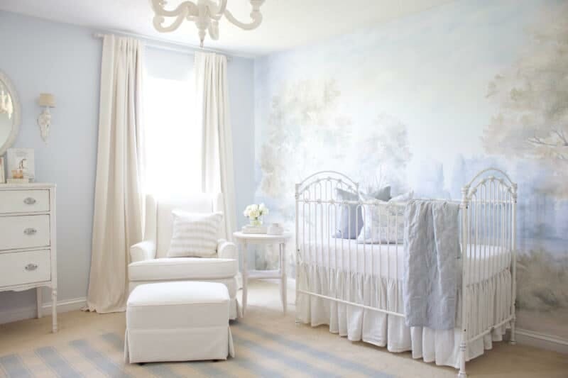 Nursery with scenic mural wallpaper