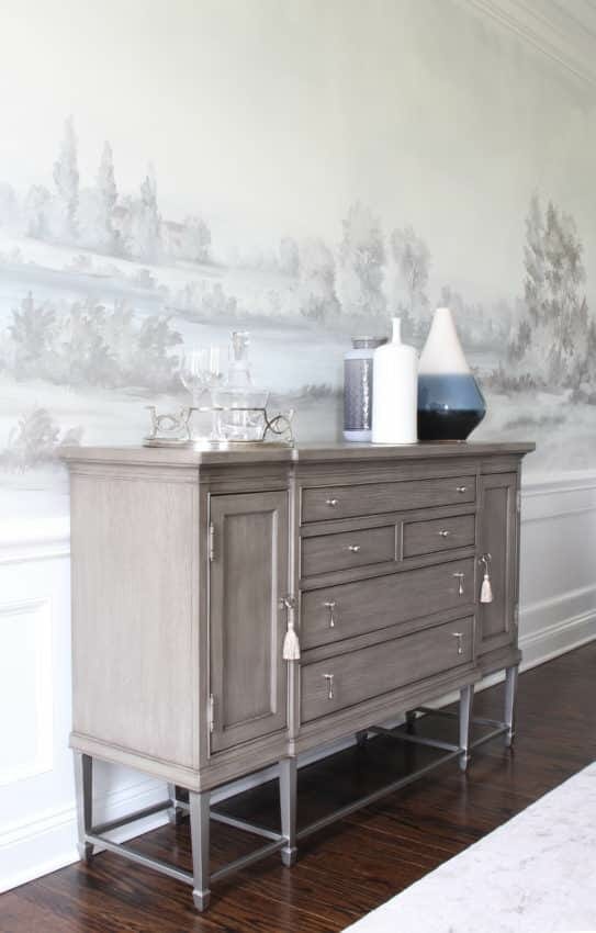Gray cabinet with scenic mural wallpaper