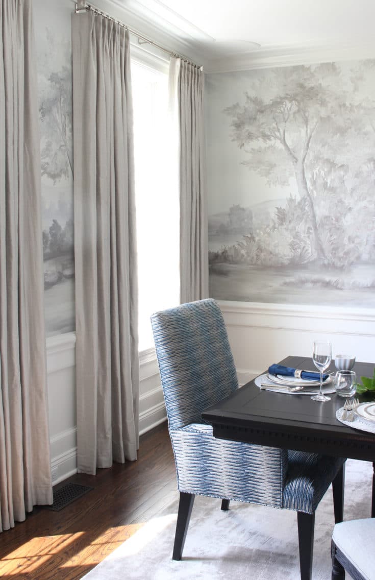 Gray dining room with scenic mural wallpaper