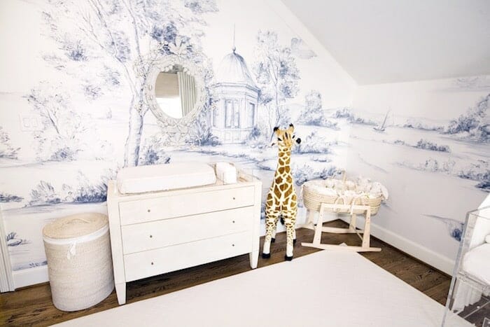 Soft blue nursery with scenic mural wallpaper