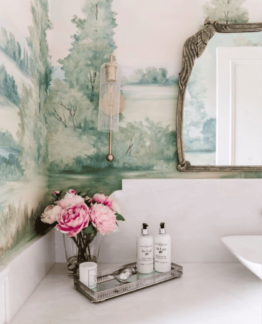 modern powder room with black and white elements and a colorful landscape mural